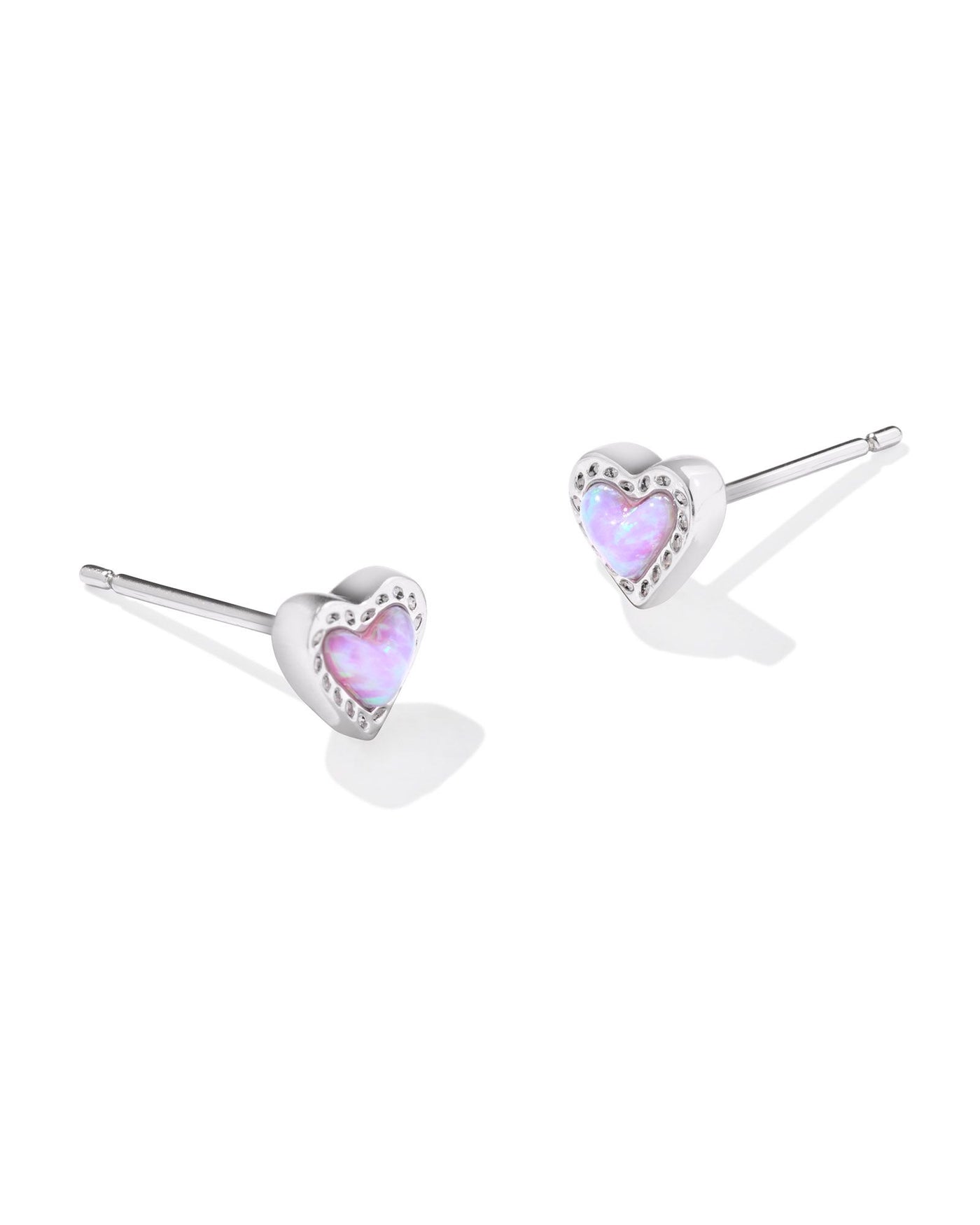 Silver framed pink kyocera opal heart studs, front view.