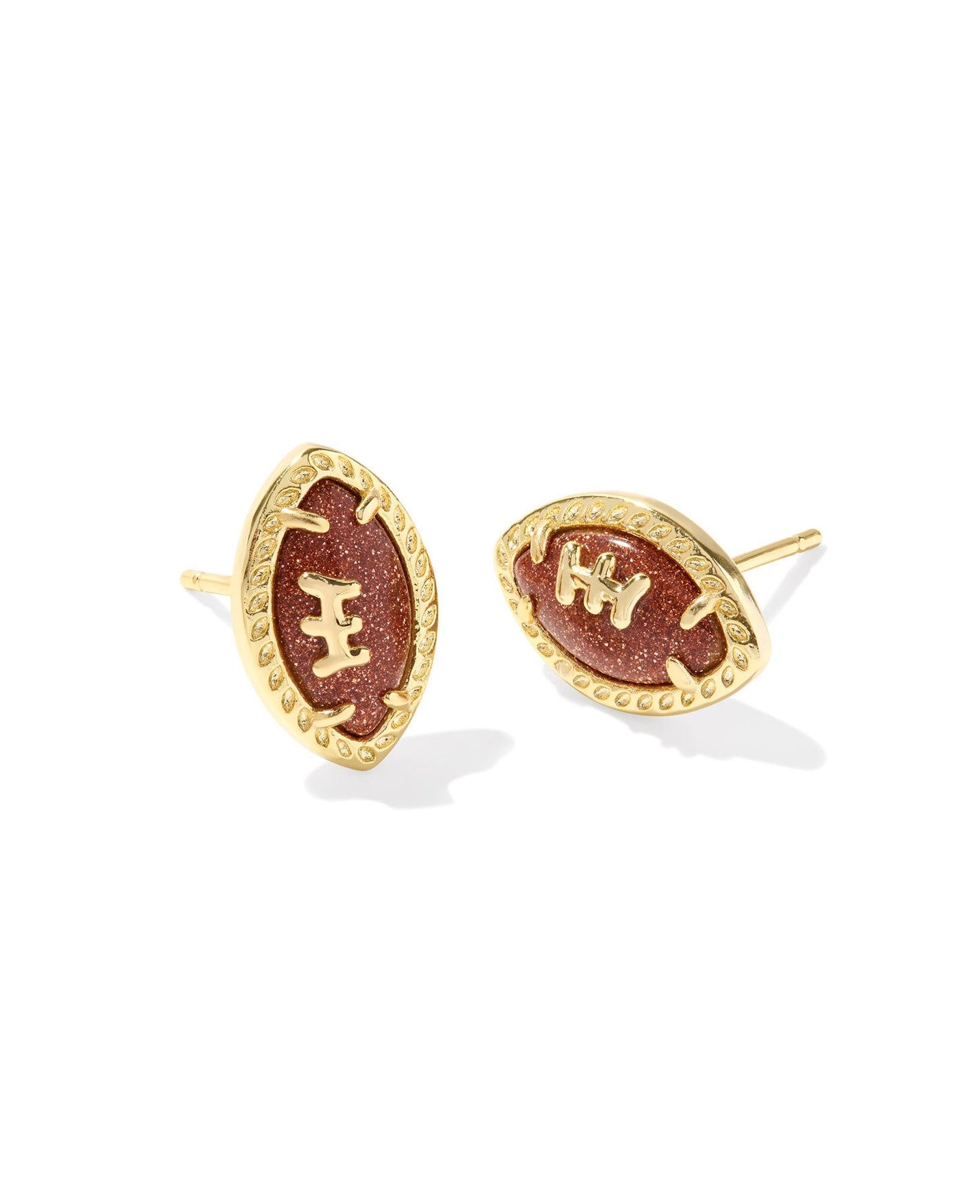 Gold framed football stud earrings.