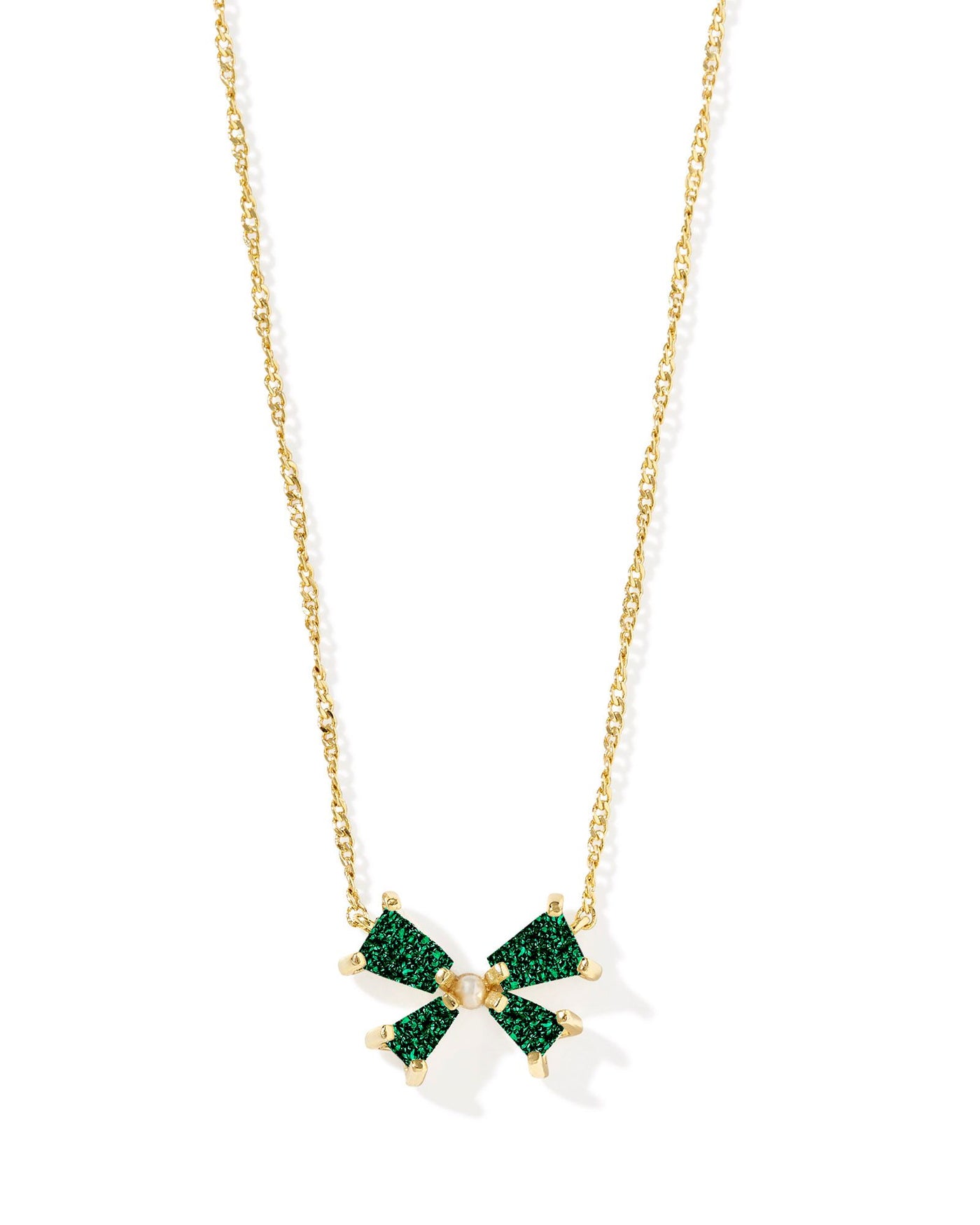 Gold necklace with emerald drusy bow and pearl center, closeup.