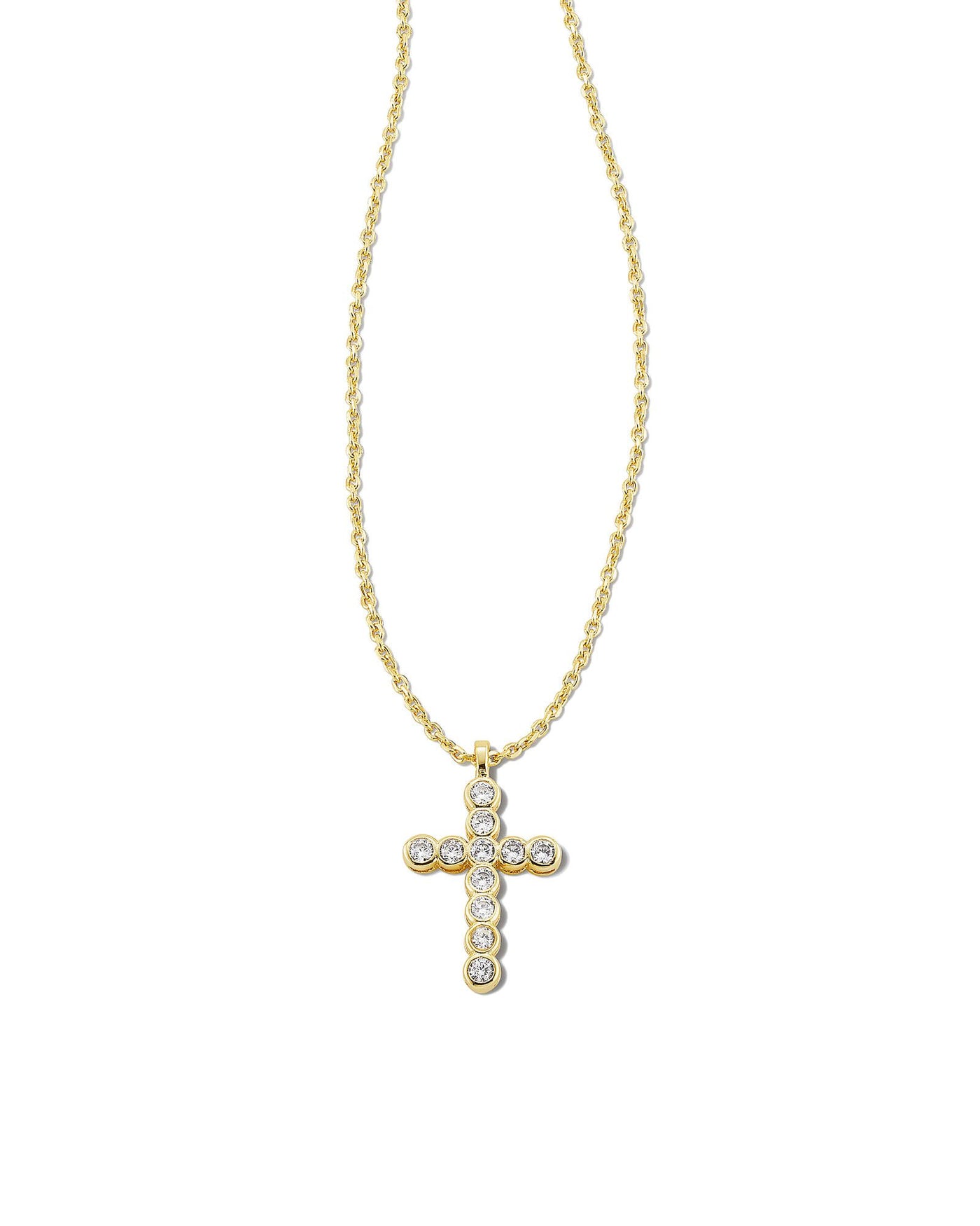 Kendra Scott Crystal Cross Pendant Necklace Gold closeup on white background.