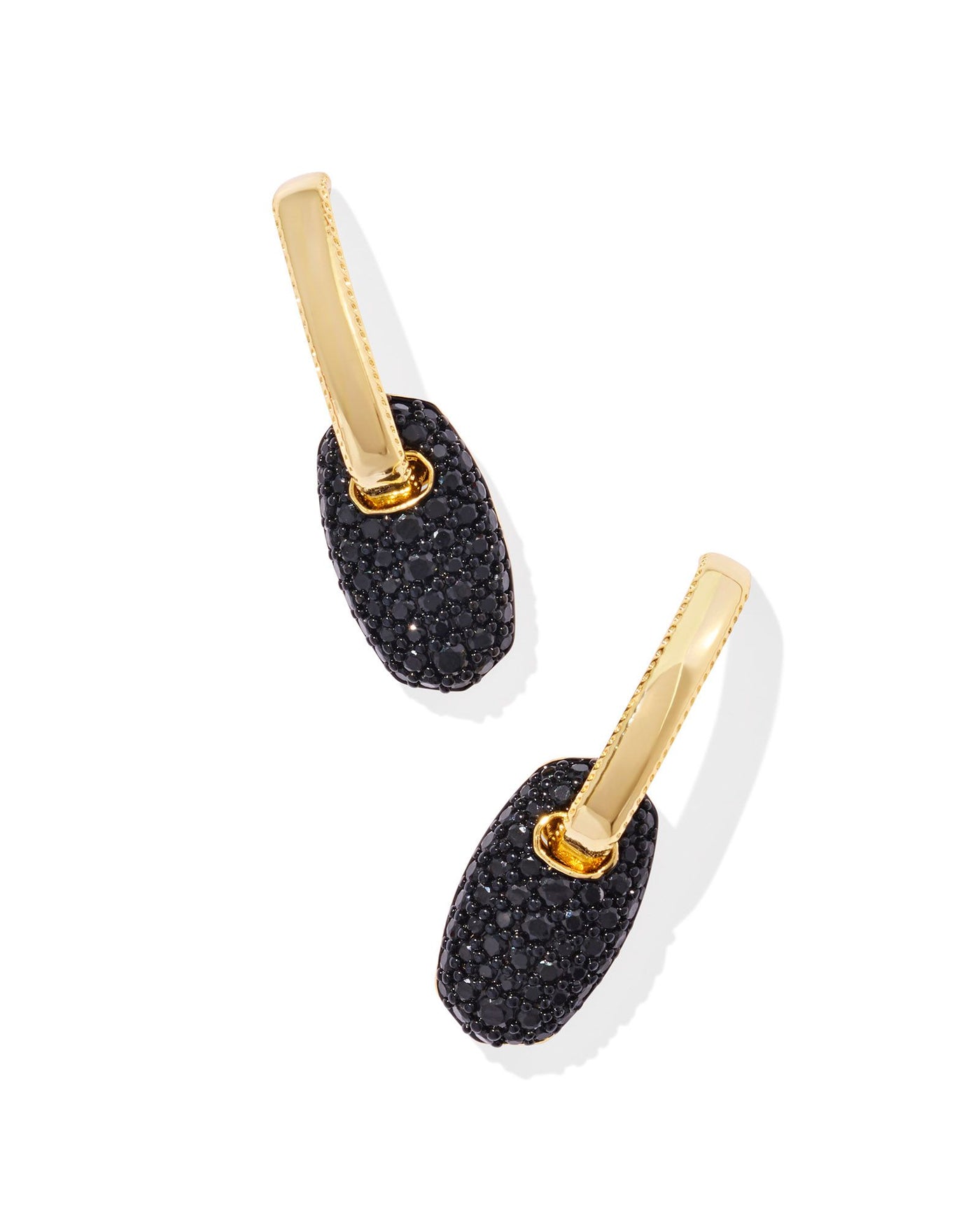 Gold huggie hoops with black crystal pave oval pendant, front view.