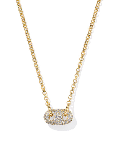 Gold necklace with white crystal pave oval pendant, closeup.