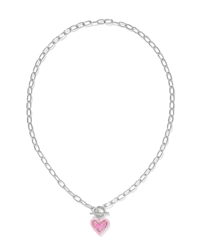 Silver link chain necklace with pink enamel framed pink iridescent glitter glass heart pendant, full view.