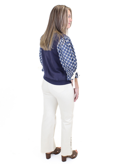 Eyelet Bow Sleeve Top - Navy back view.