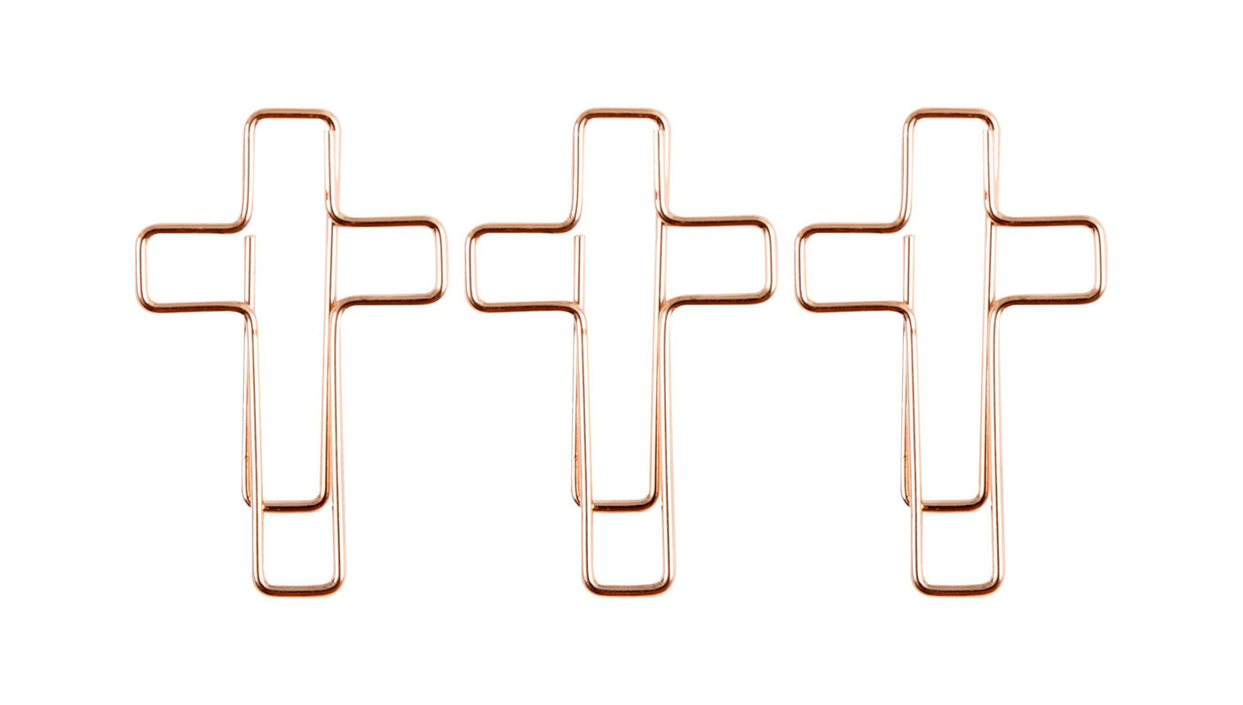 Cross shaped rose gold paper clips.