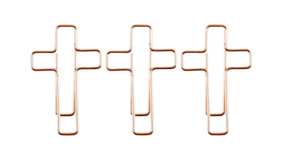 Cross shaped rose gold paper clips.