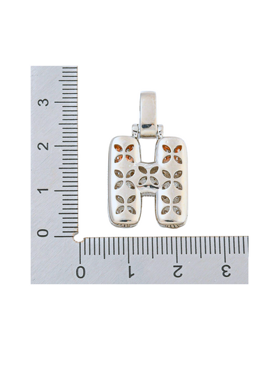 Back view of the Silver Rhinestone Bubble Letter "H" Charm with a ruler