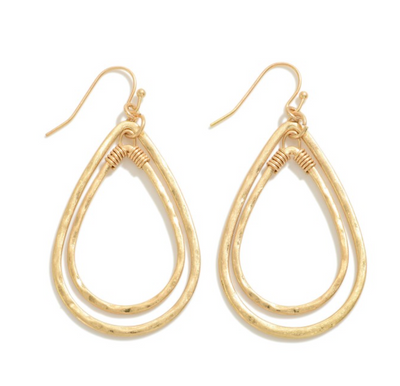 Worn Nesting Teardrop Earrings in gold.