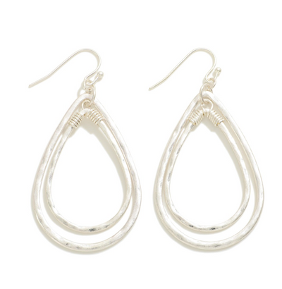 Worn Nesting Teardrop Earrings in silver.