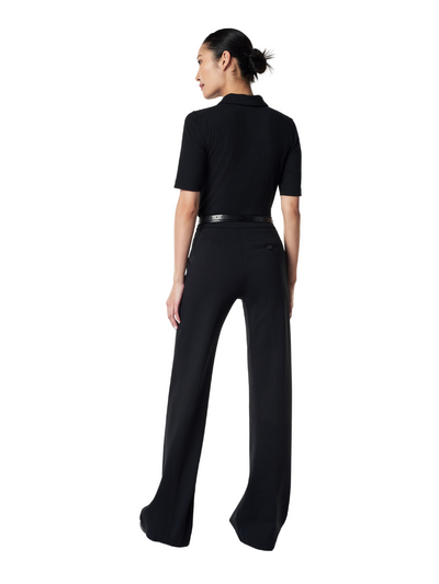 Spanx black ponte pant on model, back.