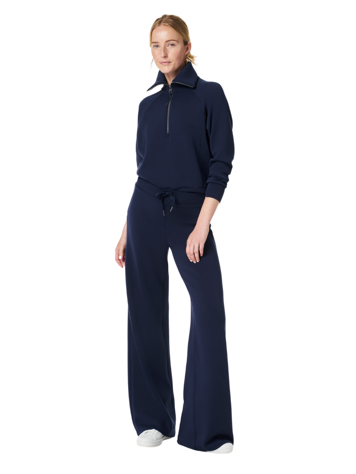 Spanx navy air essentials half-zip and wide leg pants on model, full front view.