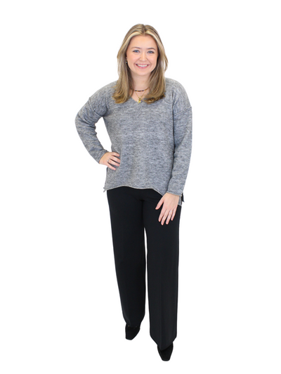 Charcoal gray v-neck sweater on model, front view, full body.