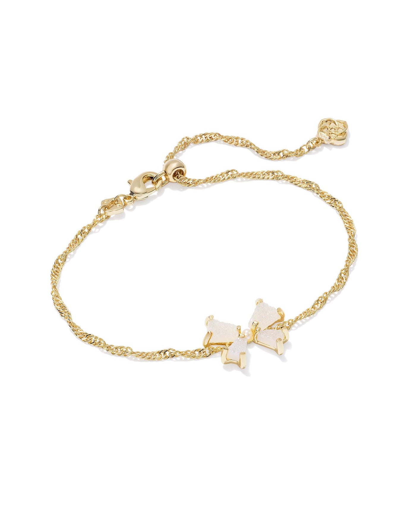 Gold bracelet with iridescent drusy bow pendant and pearl center.