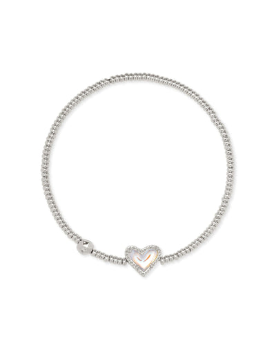 Silver beaded stretch bracelet with iridescent heart pendant.