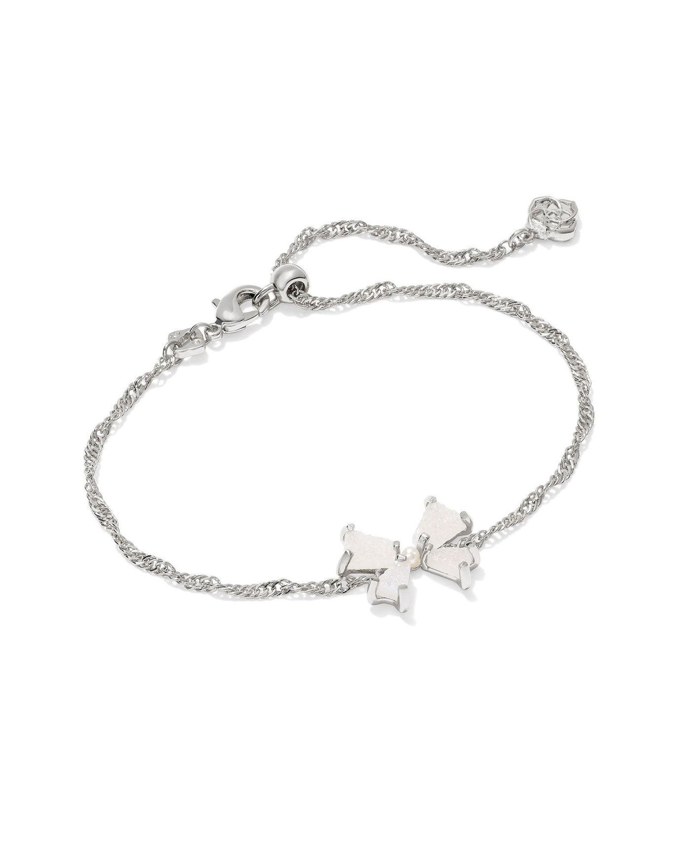 Silver bracelet with iridescent drusy bow and pearl center.