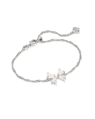 Silver bracelet with iridescent drusy bow and pearl center.