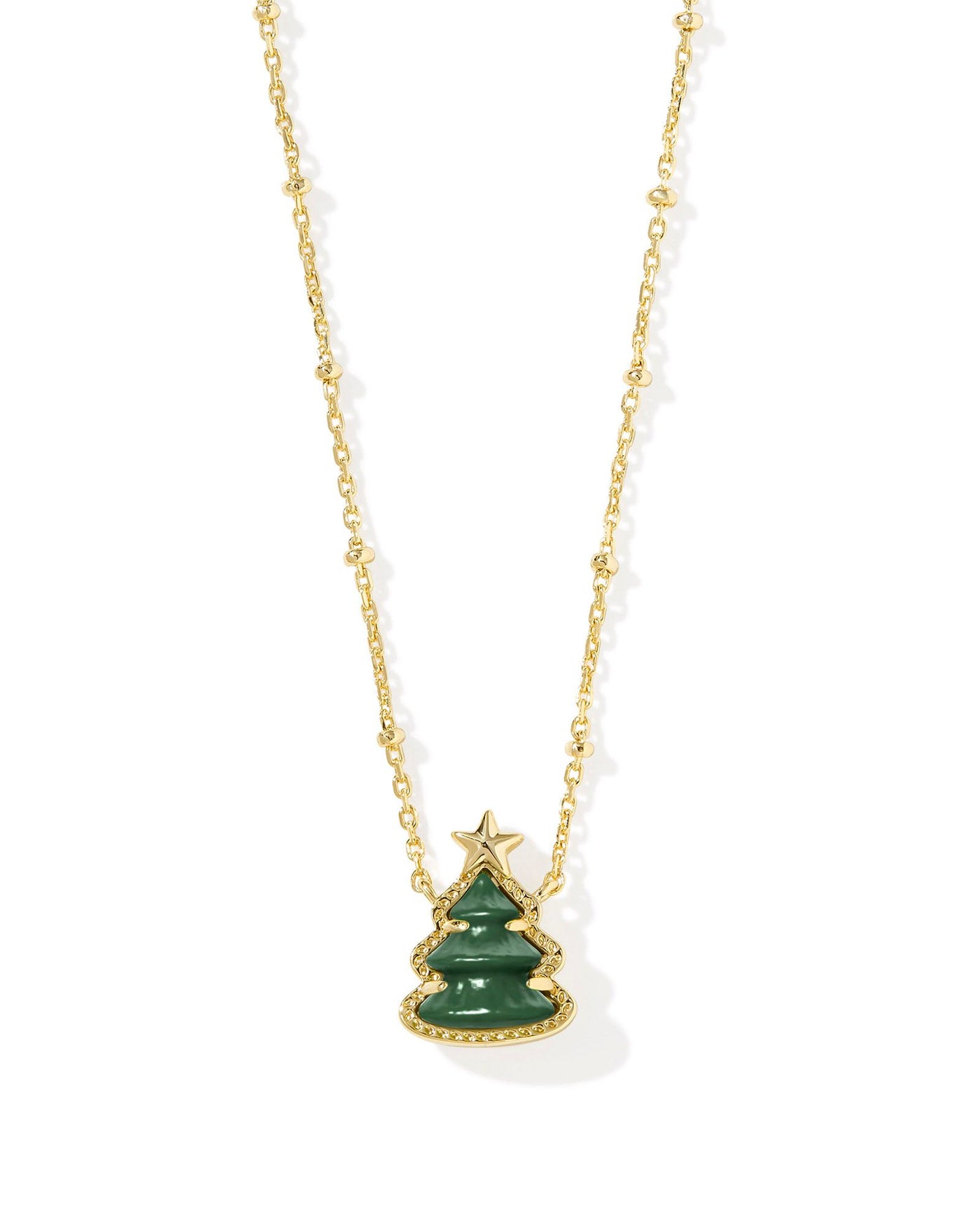 Gold satellite necklace with gold framed green christmas tree pendant, closeup front view.