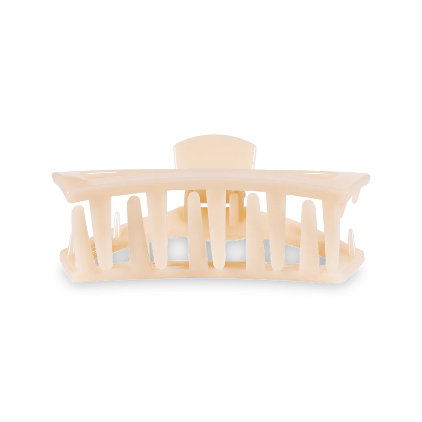 Open almond beige medium hair clip.