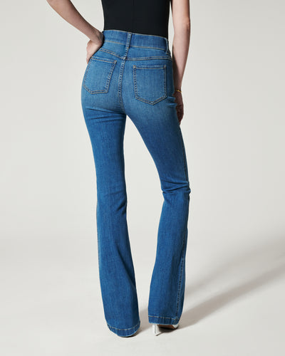 Spanx Flare Jeans in vintage indigo on model front view.