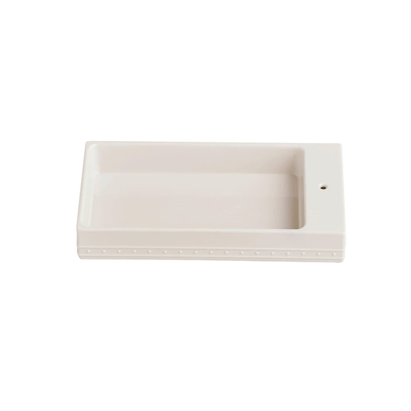 Off-white guest towel holder with raised sides with a hole for Nora Fleming minis