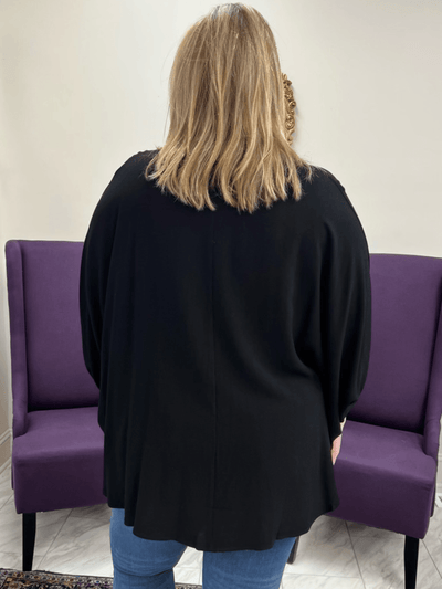 Back view of black dolman top