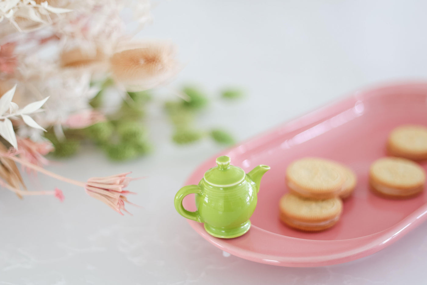 Close up of Nora Fleming lemongrass green teapot mini